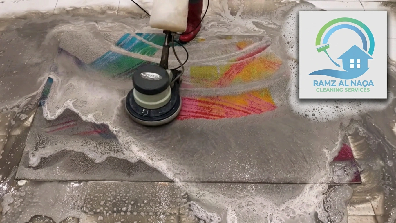 Professional carpet cleaning in Sharjah with a floor buffer machine scrubbing a foamy rug.